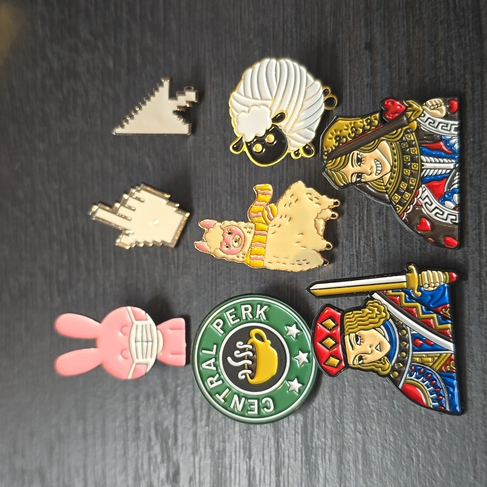 A set of 8 enamel pins